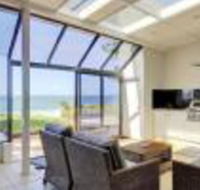 Whispering Sands 10 Sandy Point Road Luxury waterfront home with aircon WIFI  Foxtel - Sunshine Coast Tourism