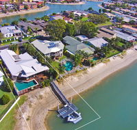 Coorumbong 16 - 5 BDRM Canal Home with Pool