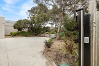 SeaSide Serenity tennis court  back beach