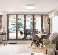 Beachfront Manly Apartment With Parking and Balcony - Holiday Sunshine Coast